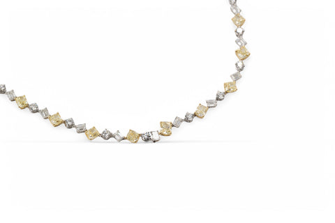 Yellow and white gold necklace with fancy yellow diamond