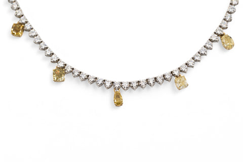 Yellow and white gold necklace with fancy yellow diamond