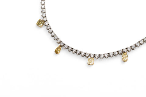 Yellow and white gold necklace with fancy yellow diamond